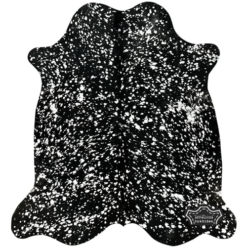 Metallic silver devore on solid black cowhide rug